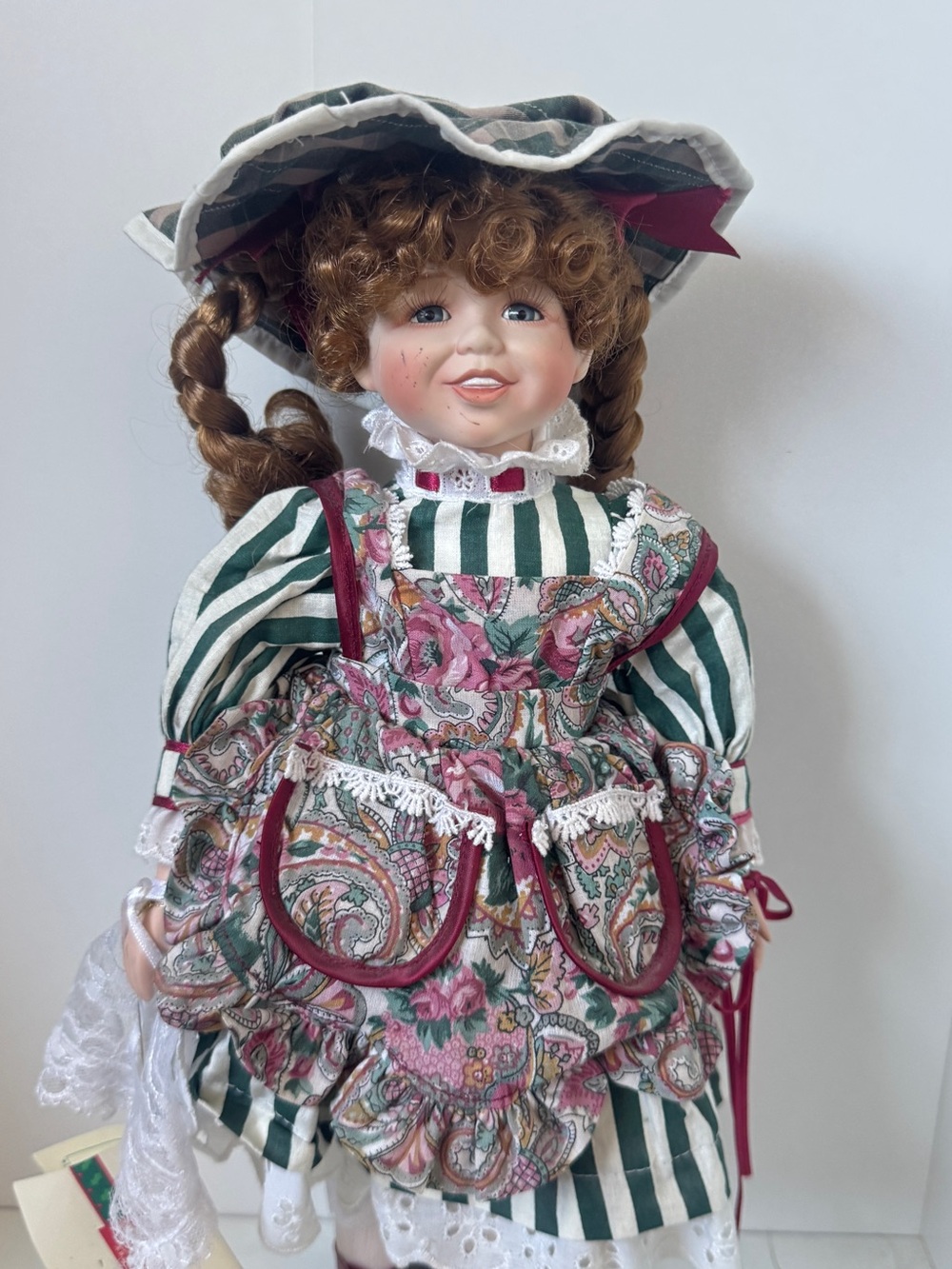 Porcelain-Style Girl Doll in Green Stripe and Pink Paisley Dress